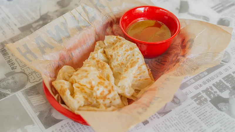 Hawkers Asian Street Food signature dishes Roti CanaiKorean Twice Fried WingsPad ThaiYi-Yi's Chicken Dumplings